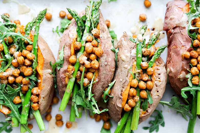 stuffed sweet potatoes with chickpeas, asparagus and arugula