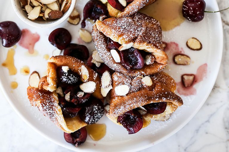 Mini BourbonSoaked Cherry and Almond Dutch Baby Pancakes Floating
