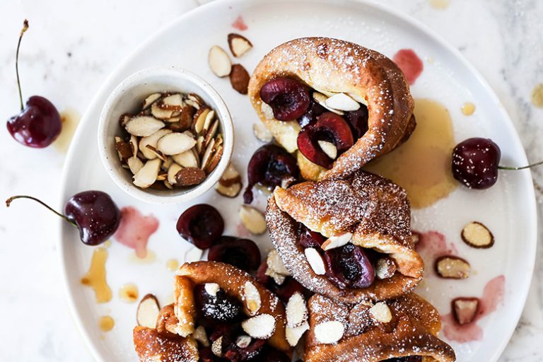 Mini BourbonSoaked Cherry and Almond Dutch Baby Pancakes Floating