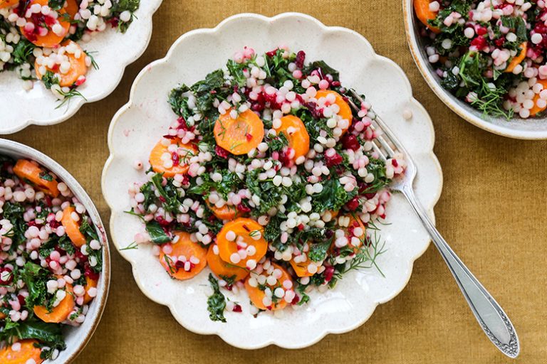 Wilted Kale and Couscous Salad with Carrots and Cranberries Floating